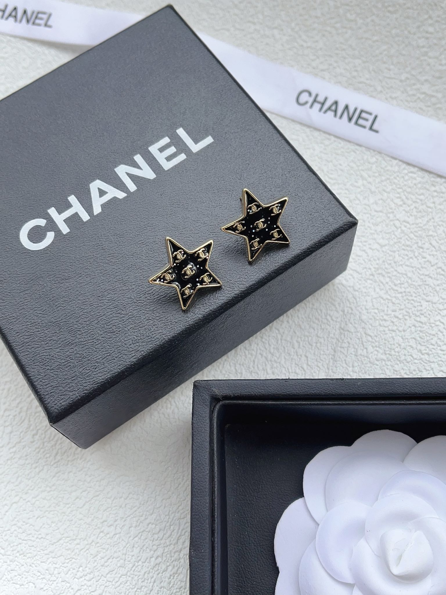 A973  Chanel star earrings